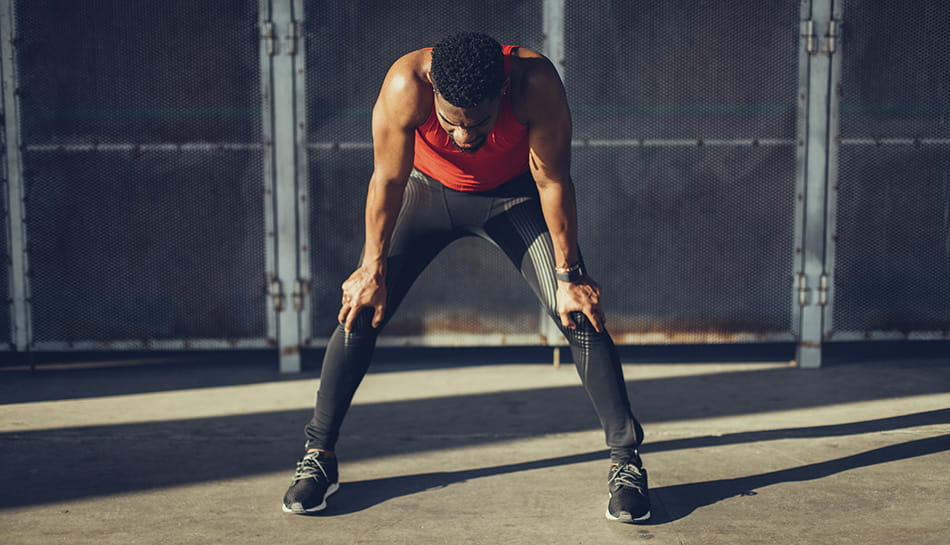 An athlete tired and struggling to breathe