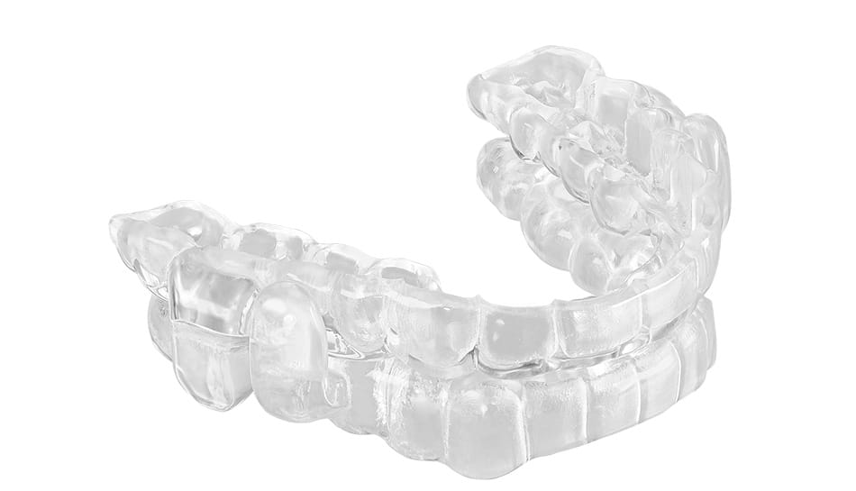 Clear oral appliance designed to treat sleep apnea by adjusting jaw position during sleep.